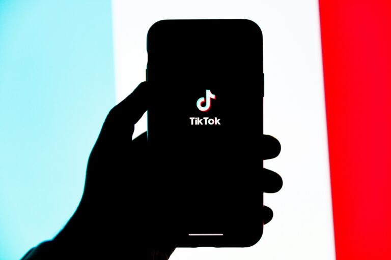 TikTok logo on smartphone screen for brand marketing strategy