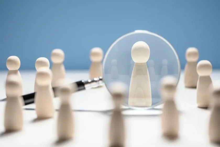 wooden figures representing brand identity and customer focus