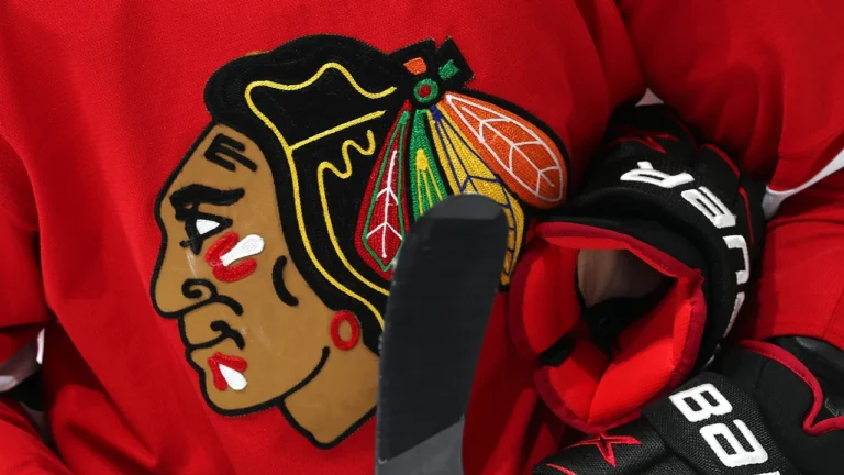 Close-up of Chicago Blackhawks logo embroidered on red hockey jersey