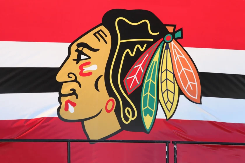 Chicago Blackhawks logo with profile of Native American chief featuring colorful feathers
